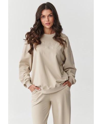 Treniņtērpu komplekts ar platām kājām un izšūtu aplikāciju gaiši bēšs M890