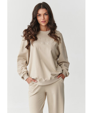 Treniņtērpu komplekts ar platām kājām un izšūtu aplikāciju gaiši bēšs M890