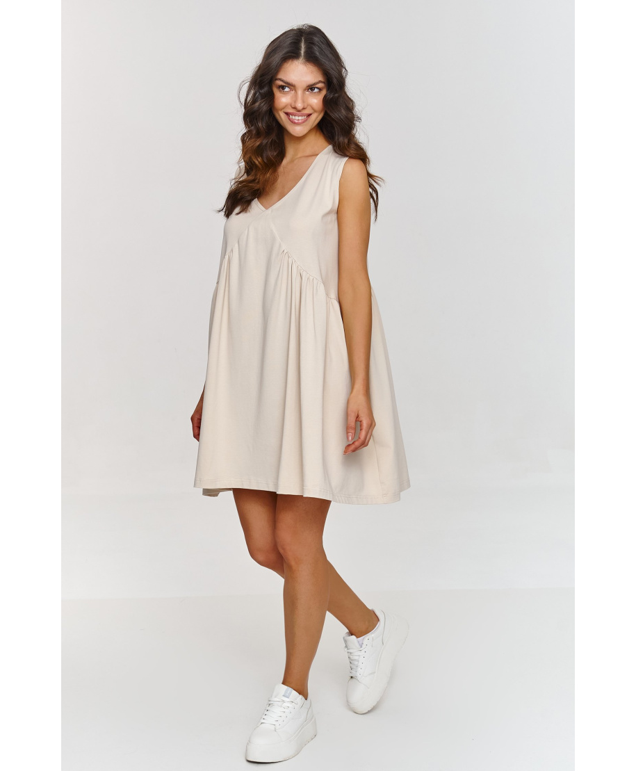 suknele trapezowa su iskirpte  serek sviesus beż M876