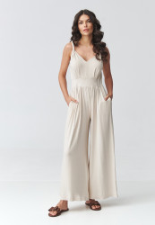 elegantiskas kombinezonas moteriskas su petneseliais sviesus beż M925